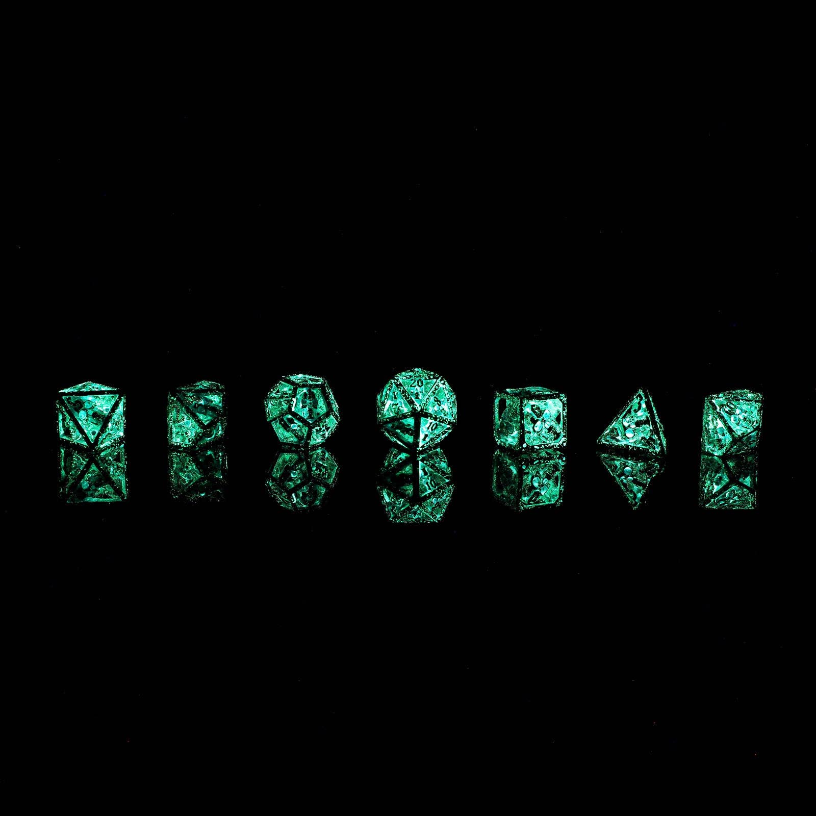 Skull's Grin Hollow Metal Dice Set - Glow in the Dark Blue - Bards & Cards