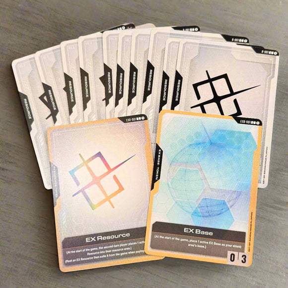 Collection of Gundam trading card resources on a wooden tabletop