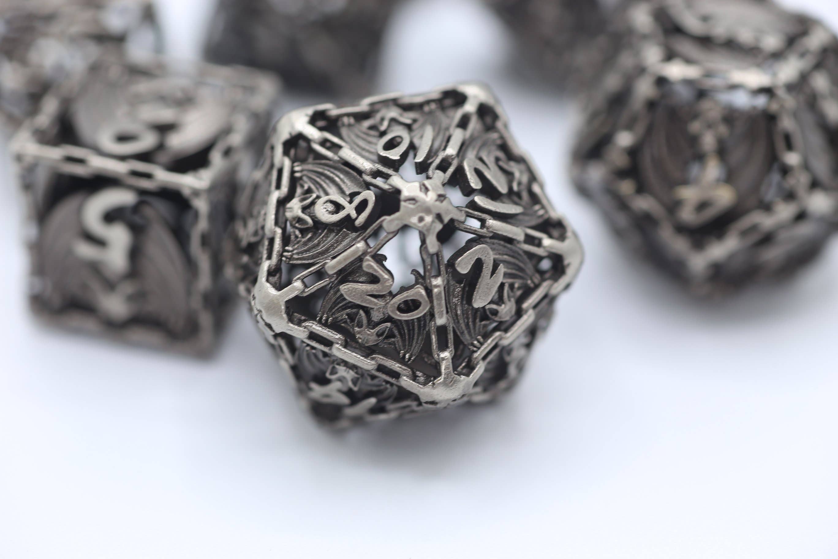 Ancient Silver Hollow Metal Bat Polyhedral Dice Set - Bards & Cards